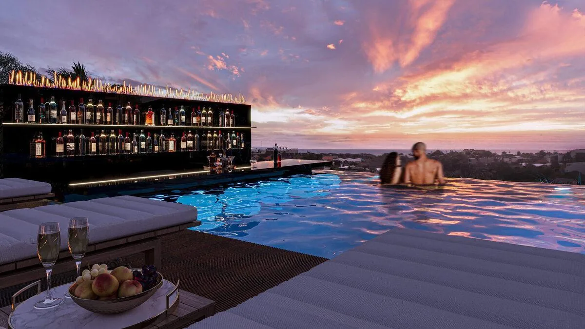 Rooftop pool bar at sunset overlooking Canggu